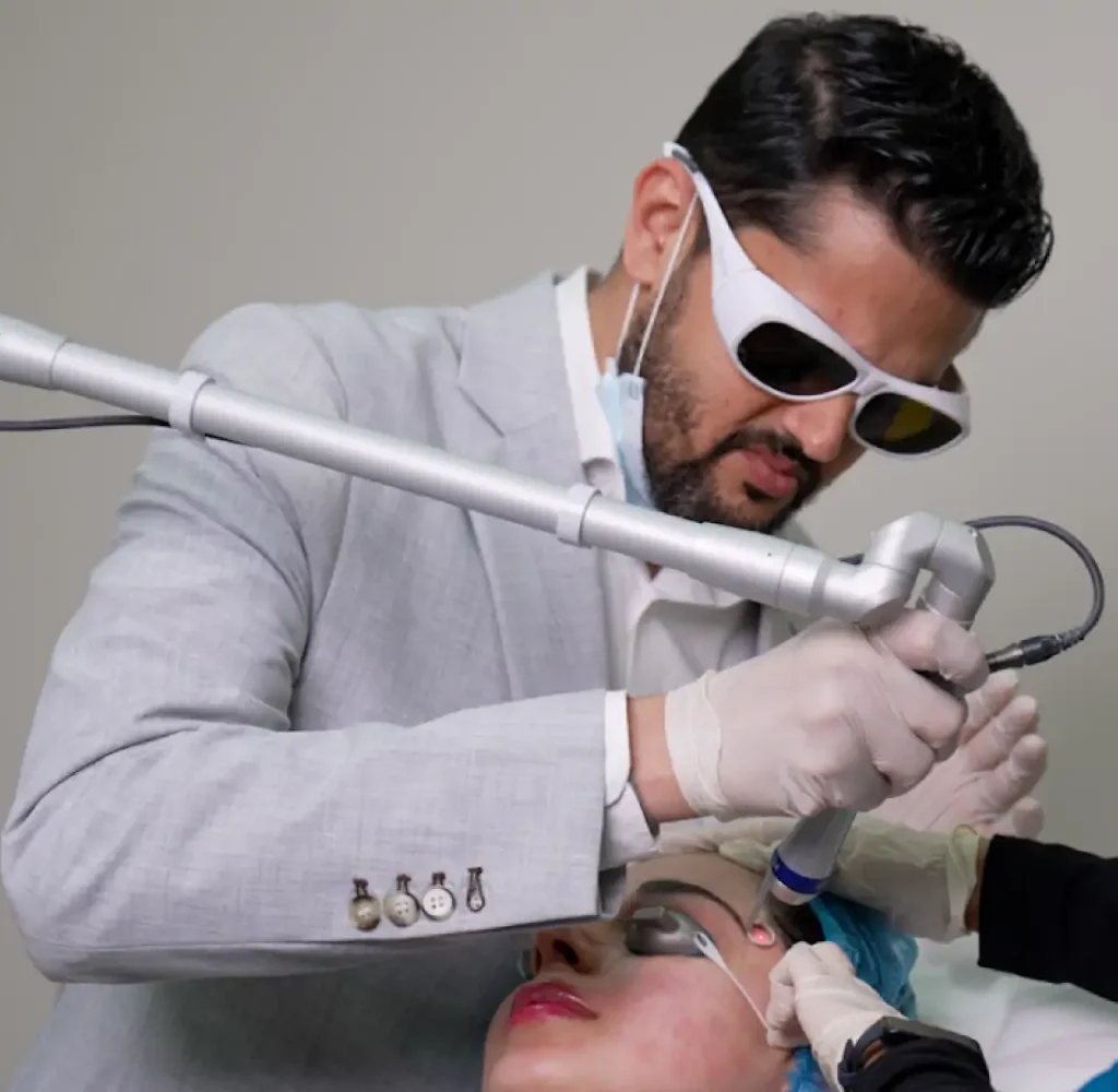 Patient receiving fractional laser treatment for pigmentation at Reveal Clinics Riyadh