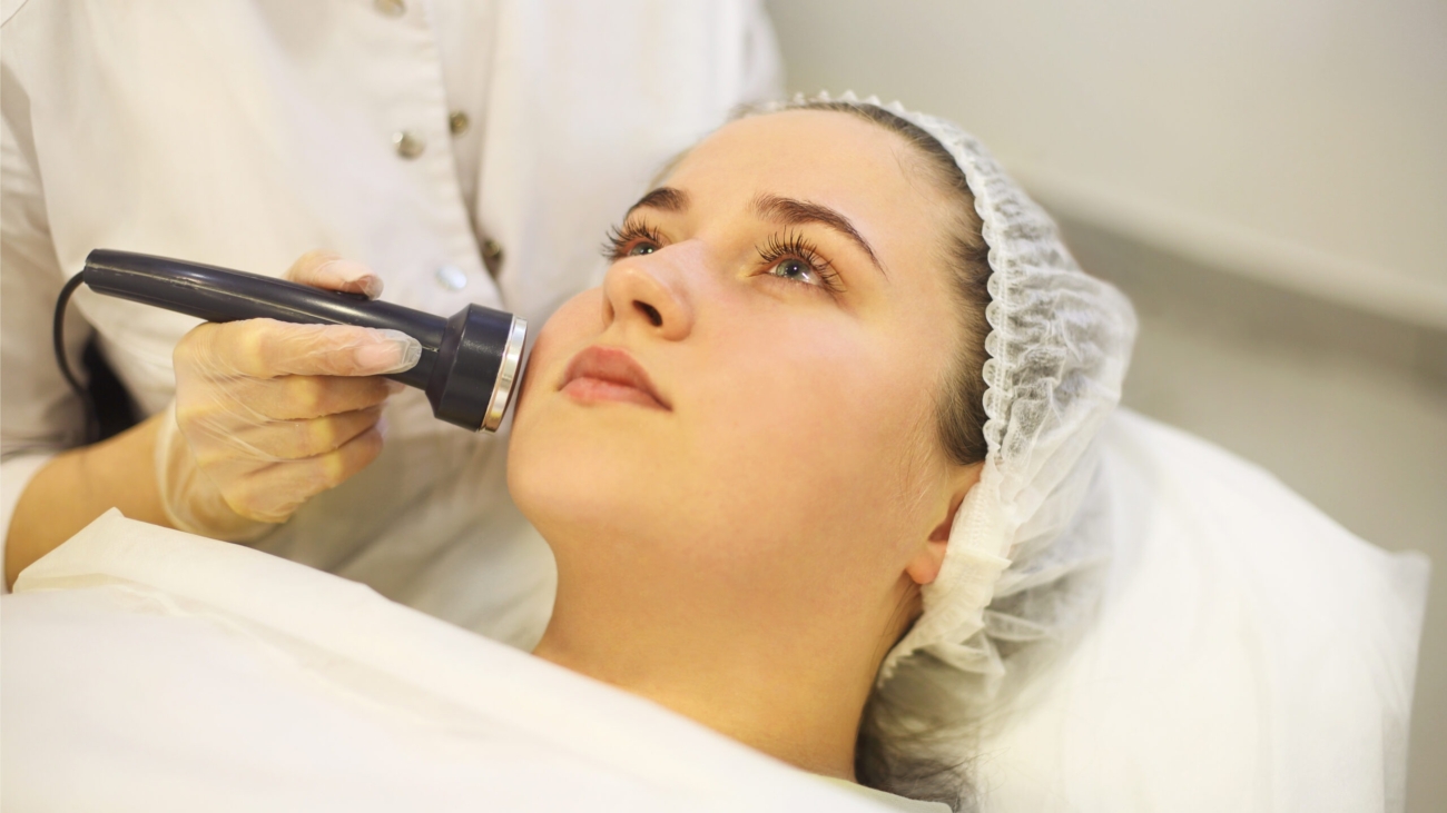 Laser treatment being performed on facial pigmentation in a clinic