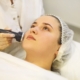 Laser treatment being performed on facial pigmentation in a clinic