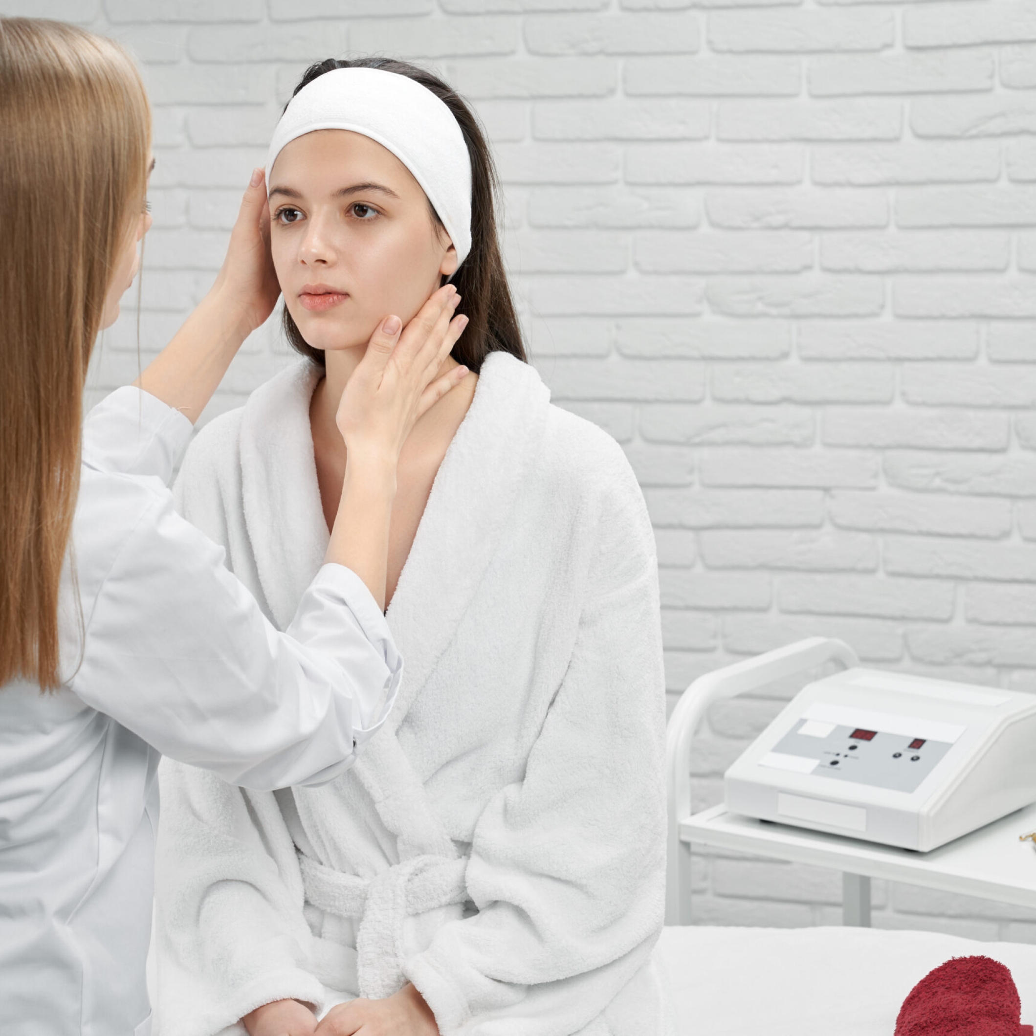Dermatologist consulting with a patient about acne scar treatment options.