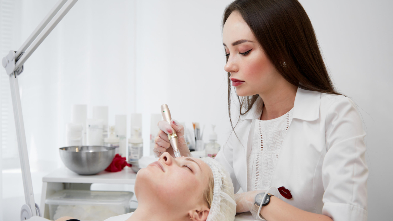 Dermatologist performing Exosome Therapy facial rejuvenation at Reveal Clinics Riyadh.