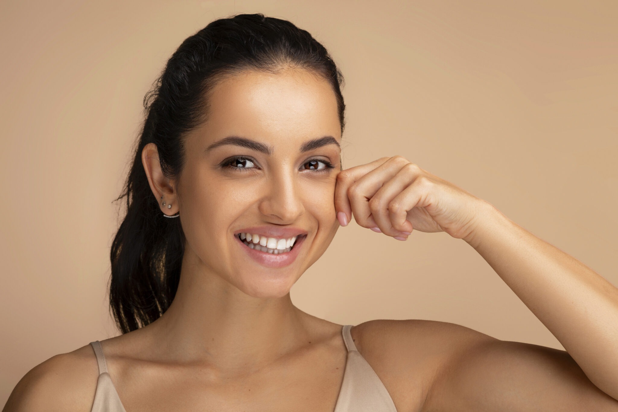 Middle Eastern woman with glowing, even-toned skin after laser resurfacing at Reveal Clinics Riyadh.