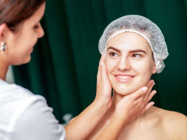 Dermatologist examining patient’s skin