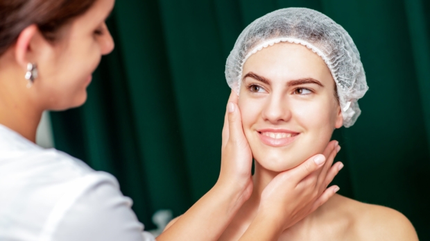 Dermatologist examining patient’s skin