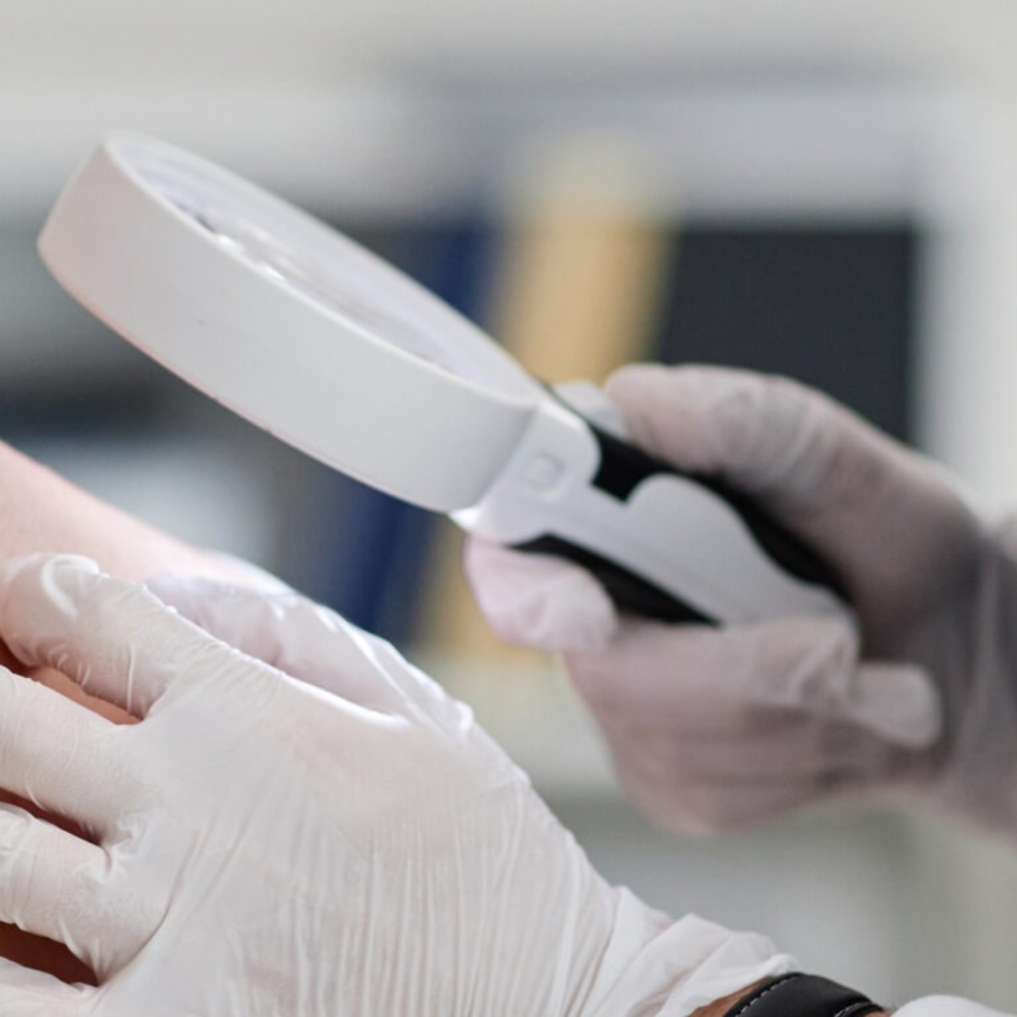 Dermatologist examining mole during Ramadan consultation